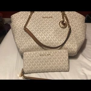 Michael kors shoulder bag/wallet set.